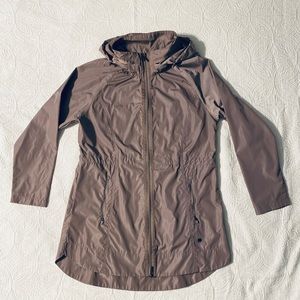 Rain jacket with cinch waist.